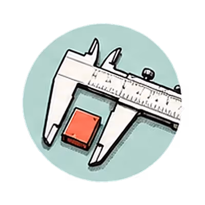 A caliper measuring a small red block